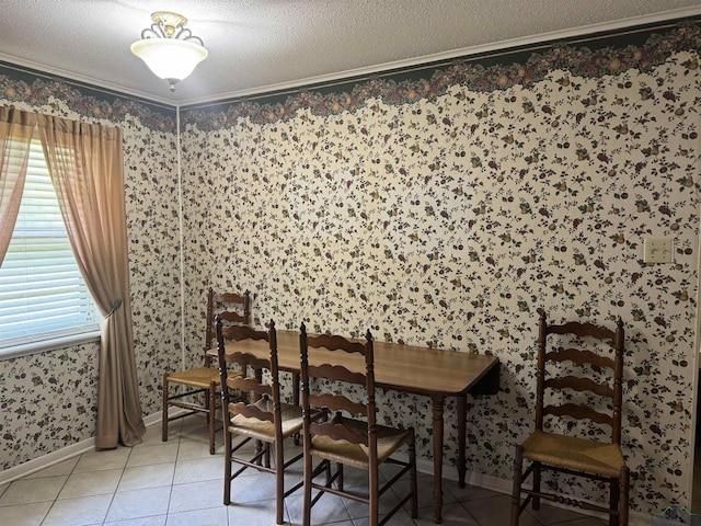 dining area featuring baseboards, ornamental molding, light tile patterned flooring, and wallpapered walls
