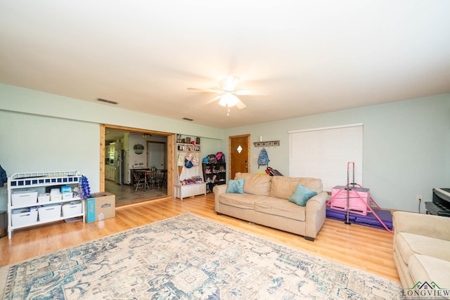12545 Fm 968 W, Longview, TX 75602 - living room featuring wood finished floors and ceiling fan