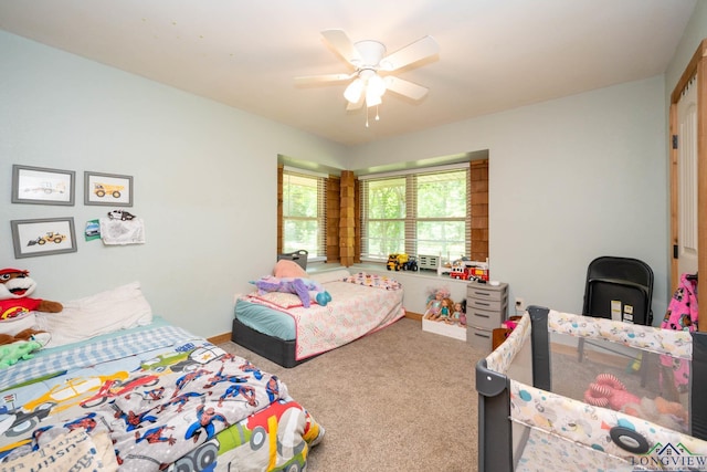 12545 Fm 968 W, Longview, TX 75602 - bedroom featuring carpet floors, baseboards, and ceiling fan