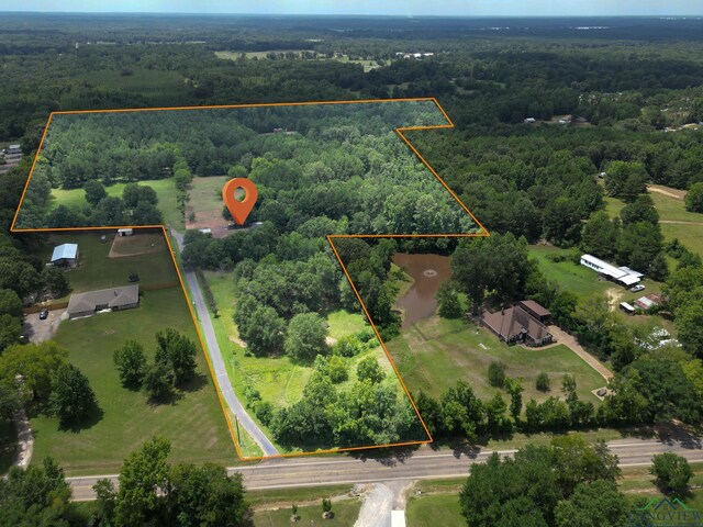 12545 Fm 968 W, Longview, TX 75602 - aerial view of property and surrounding area with a heavily wooded area and property parcel outlined