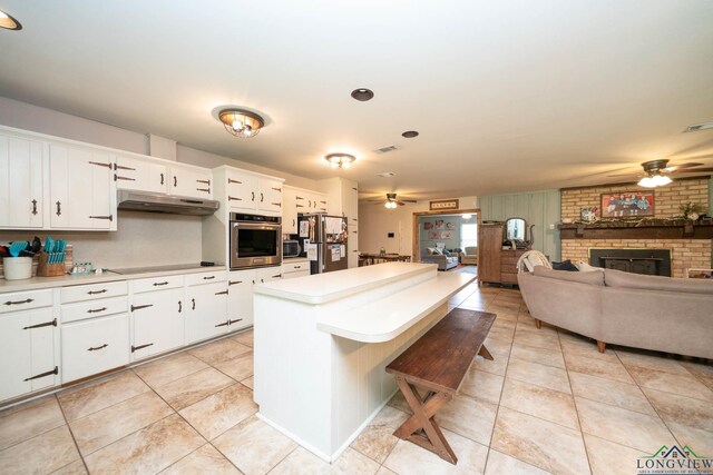 12545 Fm 968 W, Longview, TX 75602 - kitchen featuring a ceiling fan, appliances with stainless steel finishes, and light tile patterned flooring