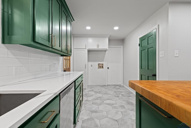 kitchen with wood counters, green cabinetry, stainless steel dishwasher, and recessed lighting