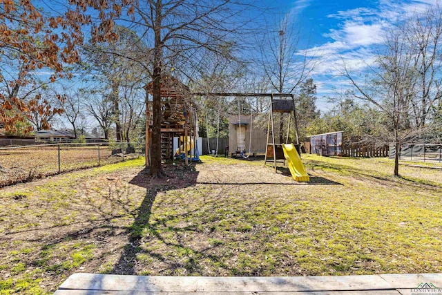 view of jungle gym featuring a yard and fence