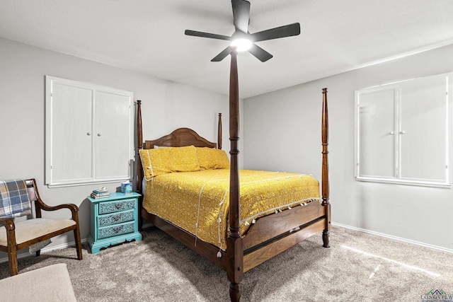 carpeted bedroom with baseboards and a ceiling fan