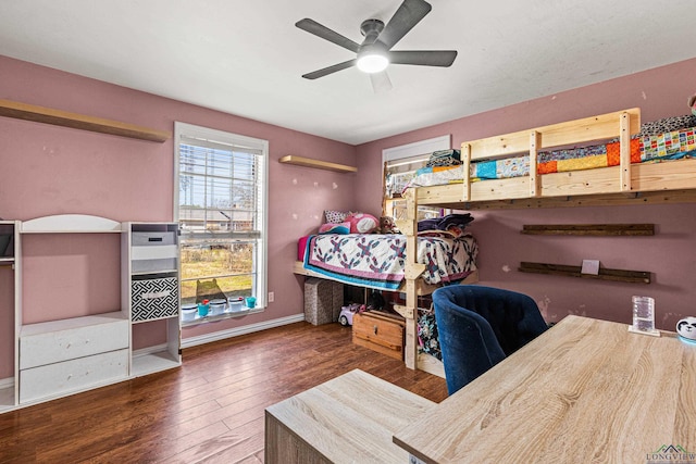 bedroom featuring a ceiling fan, baseboards, and hardwood / wood-style floors