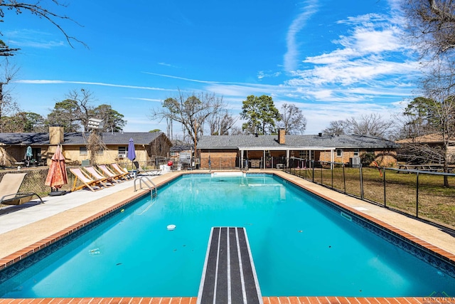 view of pool with fence, a fenced in pool, and a patio