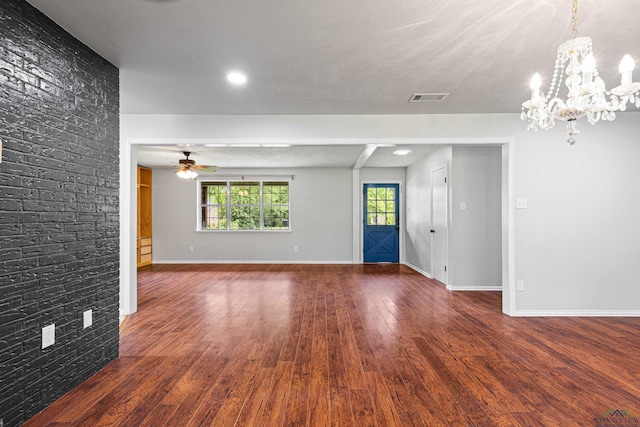 unfurnished living room with visible vents, baseboards, recessed lighting, wood finished floors, and ceiling fan with notable chandelier