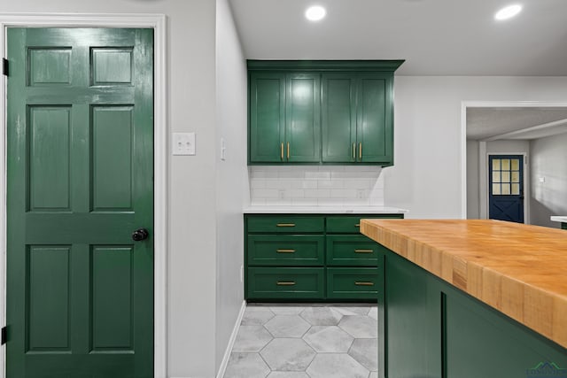 bar with baseboards, tasteful backsplash, light tile patterned flooring, and recessed lighting