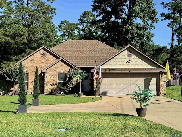 view of front facade with a front yard and a garage