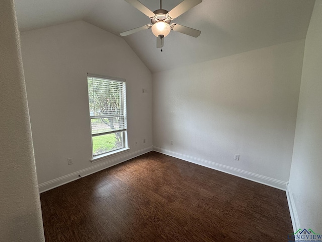 spare room with ceiling fan, dark hardwood / wood-style flooring, and lofted ceiling