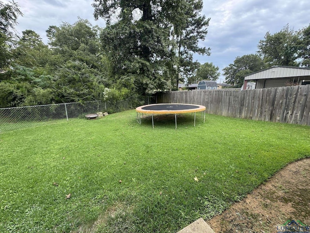 view of yard featuring a trampoline