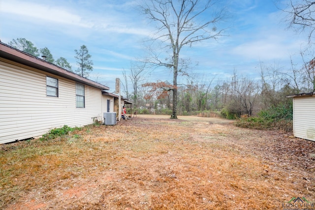 view of yard featuring central AC