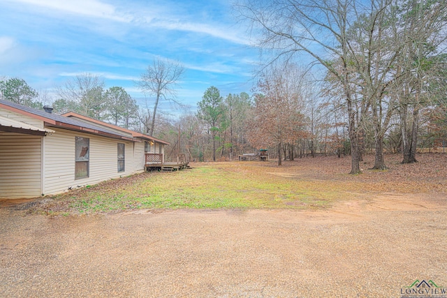 view of yard with a deck