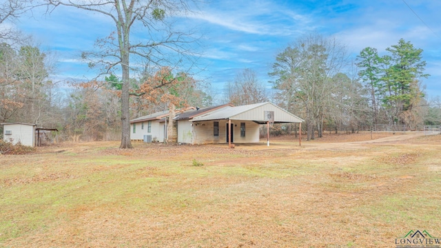 ranch-style house with a carport and a front yard