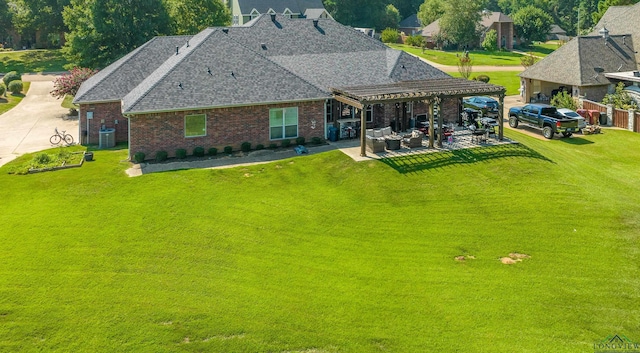 back of house with a lawn, central air condition unit, an outdoor hangout area, a pergola, and a patio