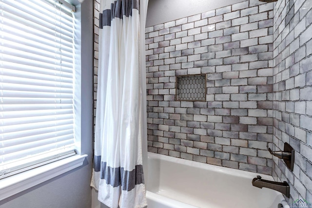 bathroom featuring shower / bath combination with curtain