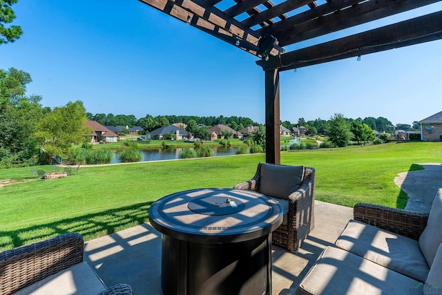 view of patio featuring a pergola and a water view