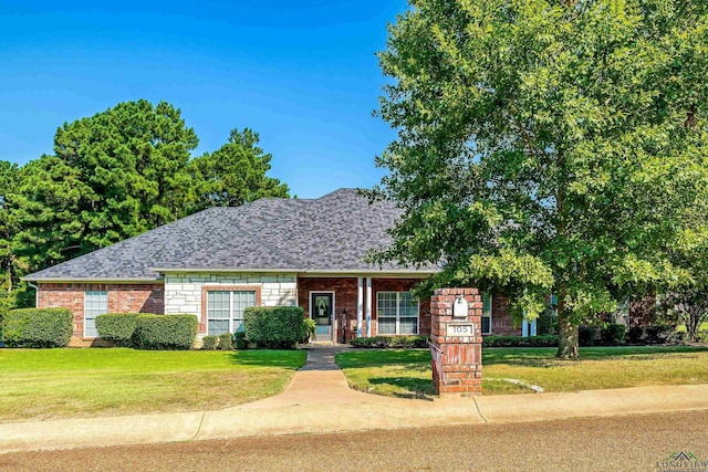 ranch-style house with a front lawn