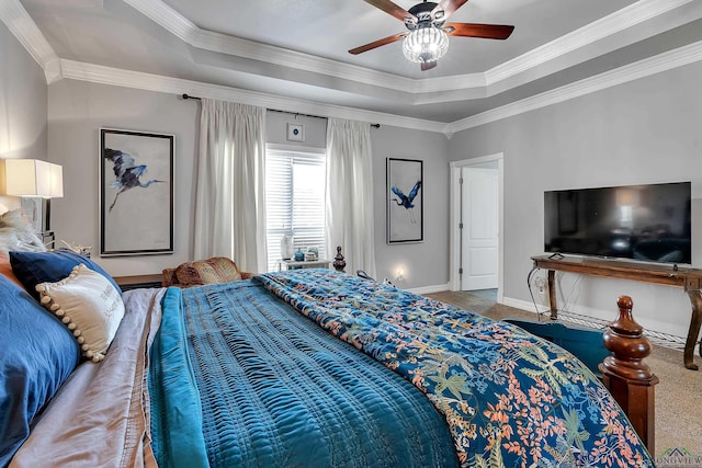 bedroom with a tray ceiling, ceiling fan, and crown molding