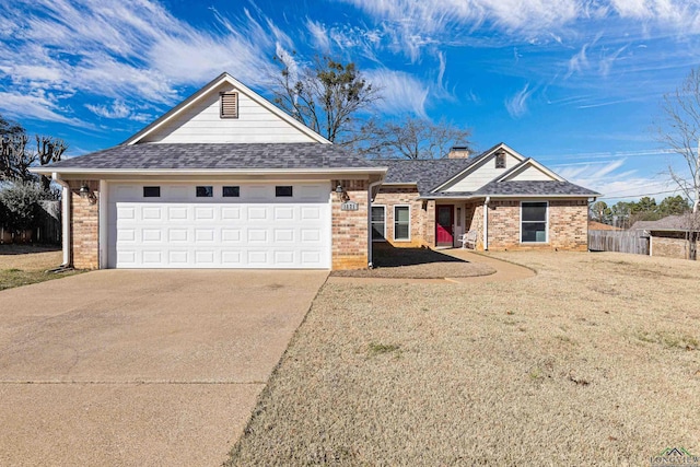 ranch-style home featuring a garage and a front lawn