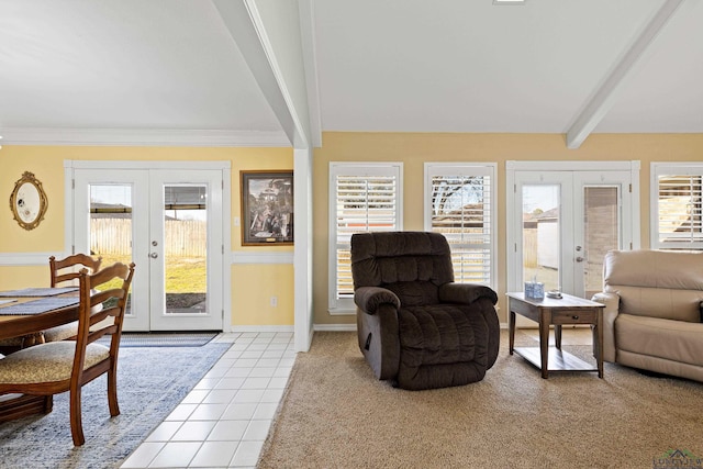 living room featuring light tile patterned floors, french doors, and beamed ceiling