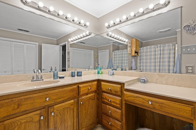 bathroom featuring a shower with curtain, ornamental molding, and vanity