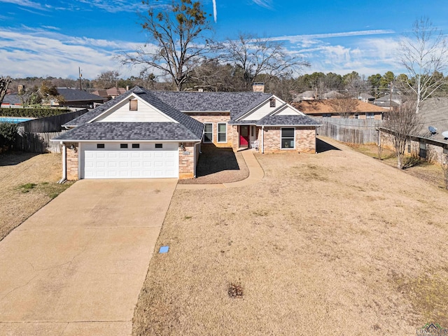 single story home featuring a garage and a front yard