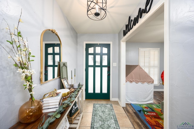 entrance foyer featuring tile patterned flooring and baseboards