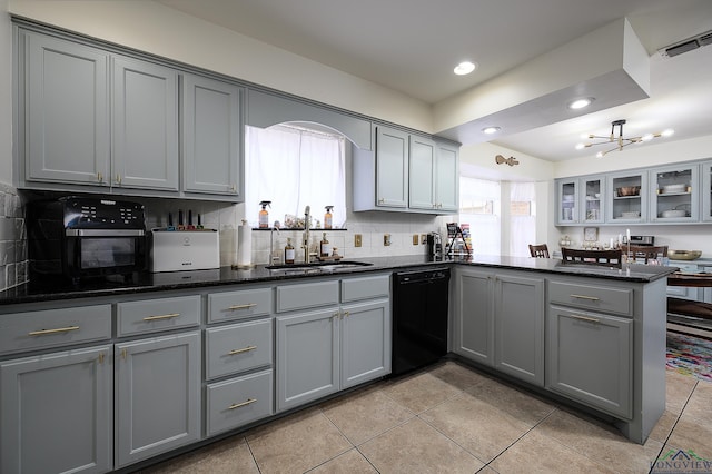 kitchen with black dishwasher, gray cabinets, and a sink