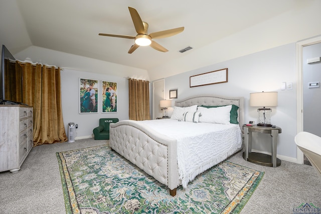 bedroom with lofted ceiling, carpet, and visible vents