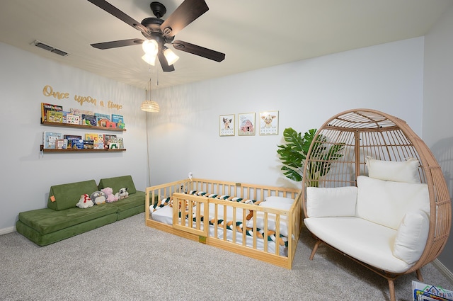 carpeted bedroom featuring visible vents and ceiling fan