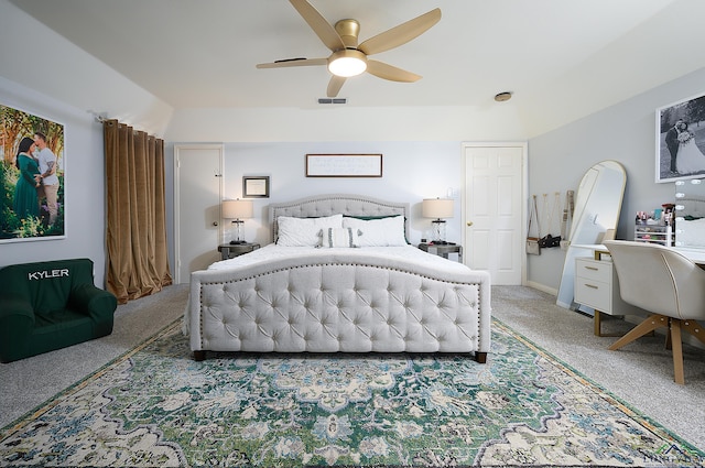 bedroom featuring visible vents, a ceiling fan, and light colored carpet