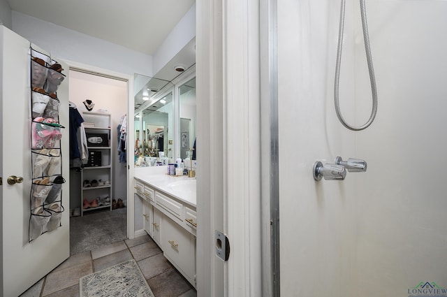 full bathroom with tile patterned flooring and vanity