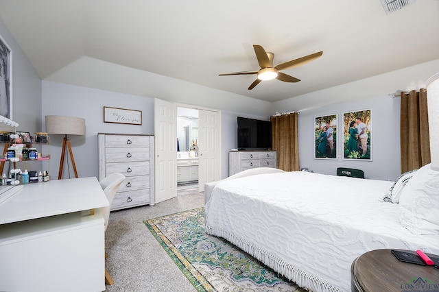 bedroom featuring ceiling fan, visible vents, and connected bathroom