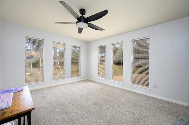 interior space with ceiling fan