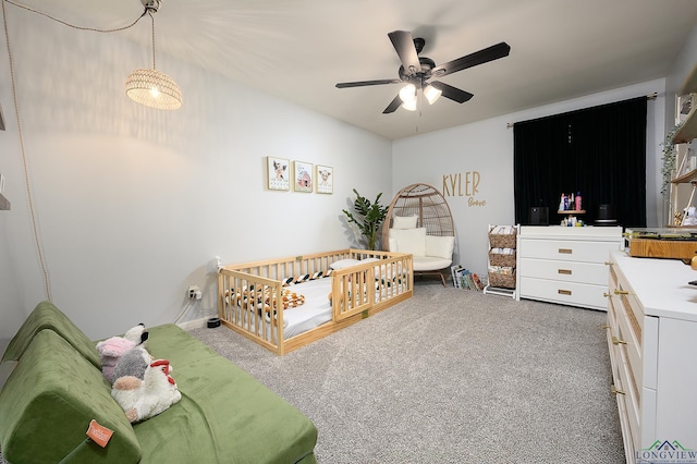 carpeted bedroom with ceiling fan