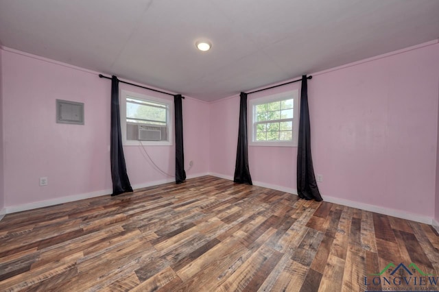 empty room with cooling unit and dark hardwood / wood-style flooring