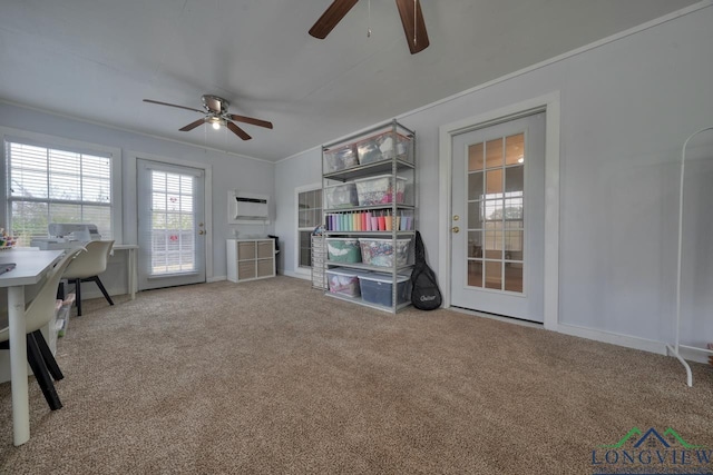 interior space with crown molding, ceiling fan, carpet floors, and an AC wall unit