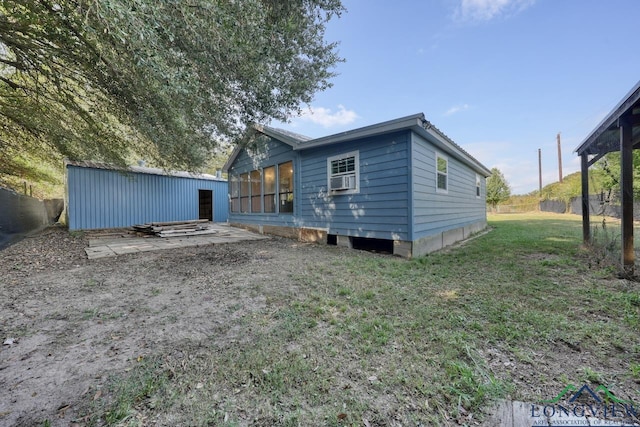 rear view of house with a lawn