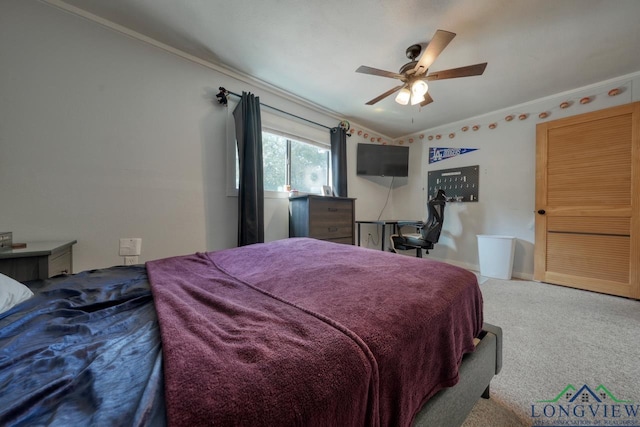 bedroom featuring crown molding, carpet floors, and ceiling fan