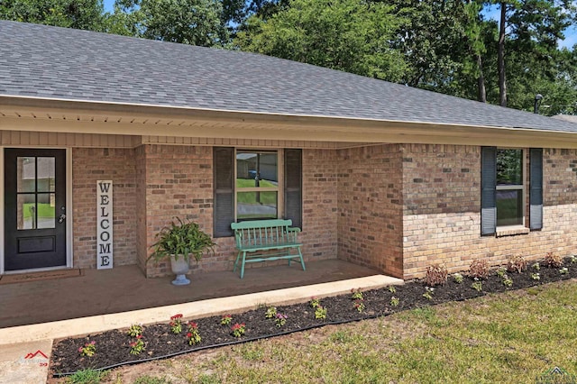 doorway to property featuring a porch