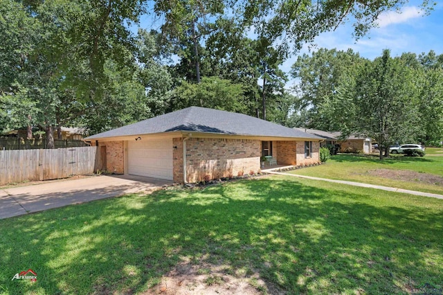 ranch-style home with a front yard and a garage