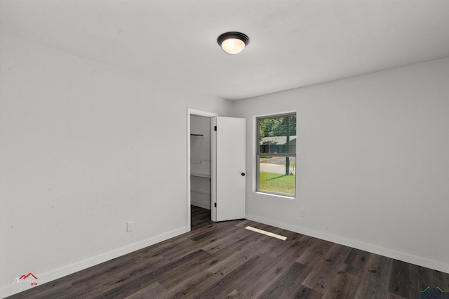 spare room featuring dark hardwood / wood-style floors