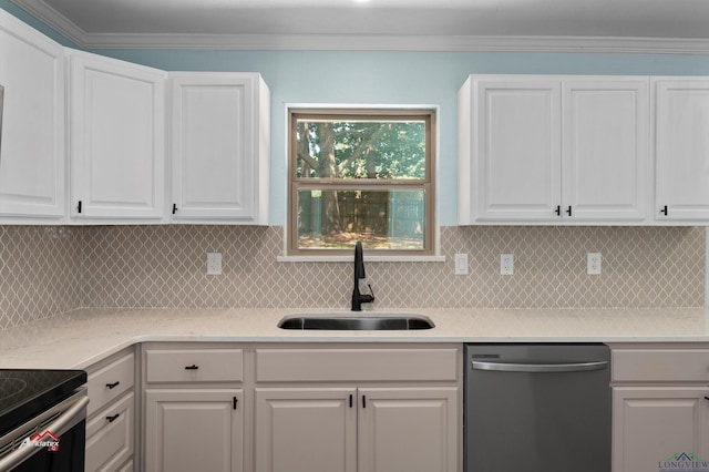 kitchen featuring appliances with stainless steel finishes, white cabinetry, tasteful backsplash, and sink