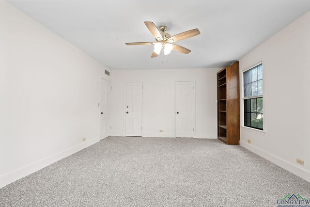 unfurnished bedroom with carpet flooring and ceiling fan