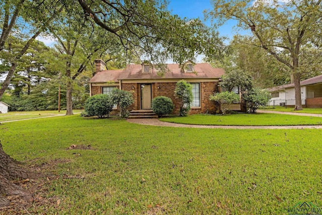 single story home with a front yard