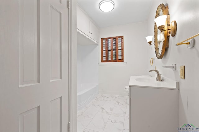 bathroom with a tub to relax in, vanity, and toilet