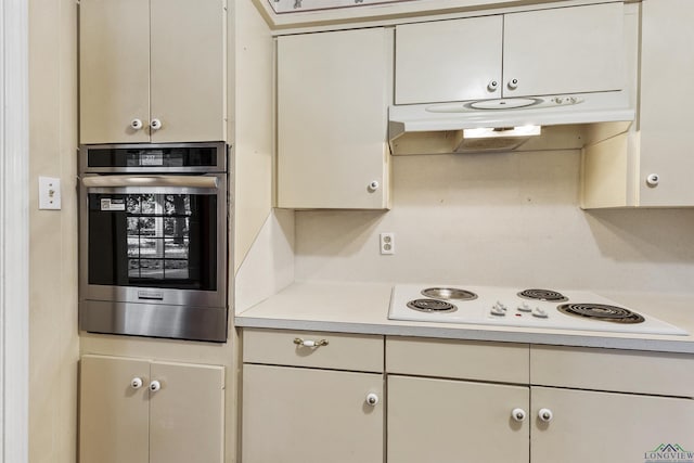 kitchen with oven and white electric cooktop