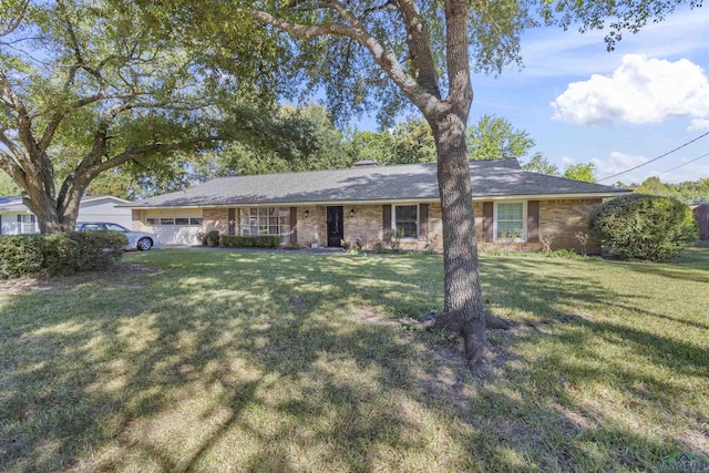 ranch-style home featuring a front yard