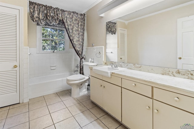 full bathroom featuring vanity, tile patterned floors, crown molding, tiled shower / bath combo, and toilet